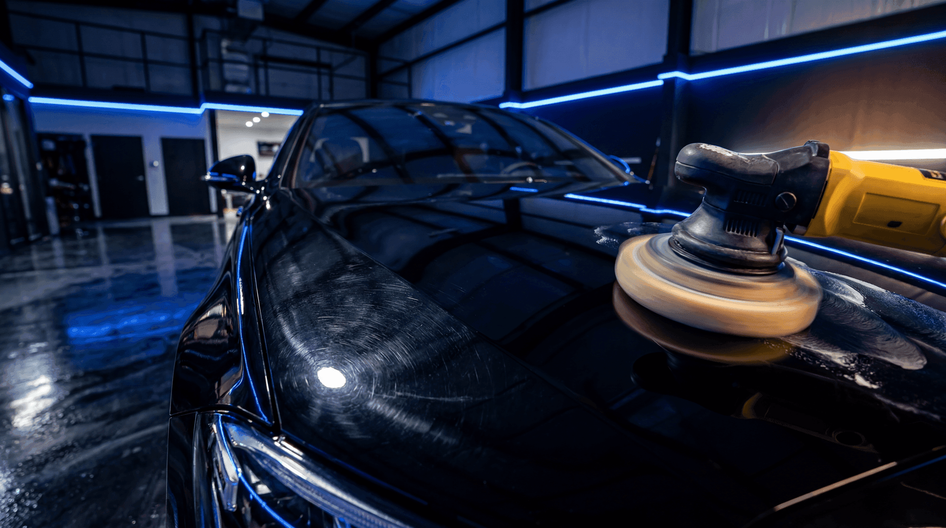 Machine paint correction removing swirl marks from dark vehicle paint
